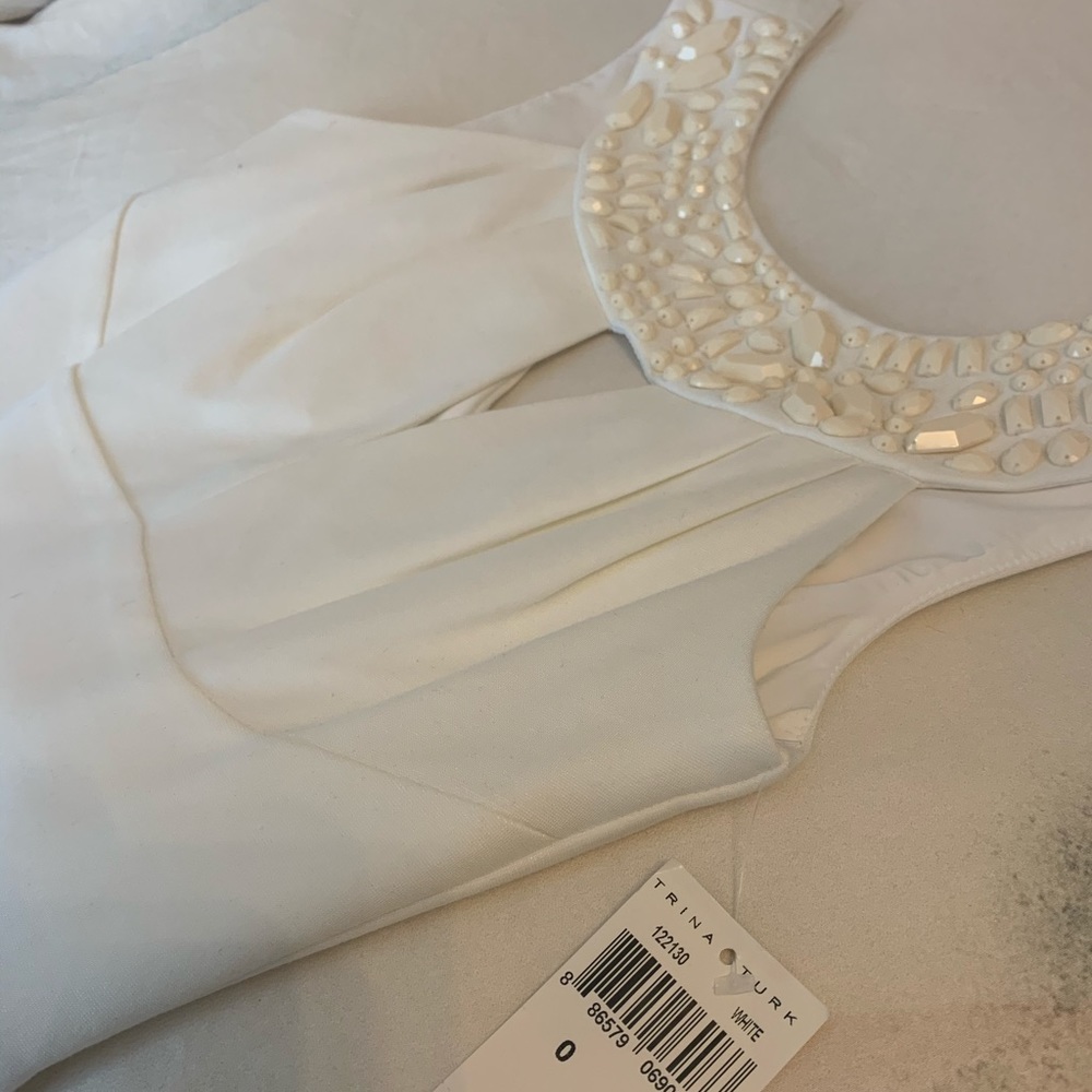 Never worn!! White Trina Turk dress with beads. Gorgeous